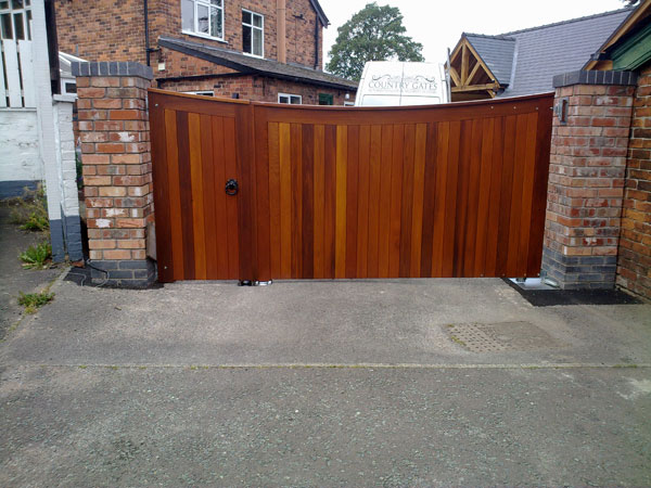 Wooden dark cedar automatic gate