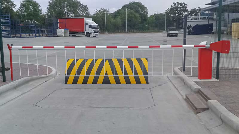 Barrier with Bottom Skirt and Rising Road Blocker