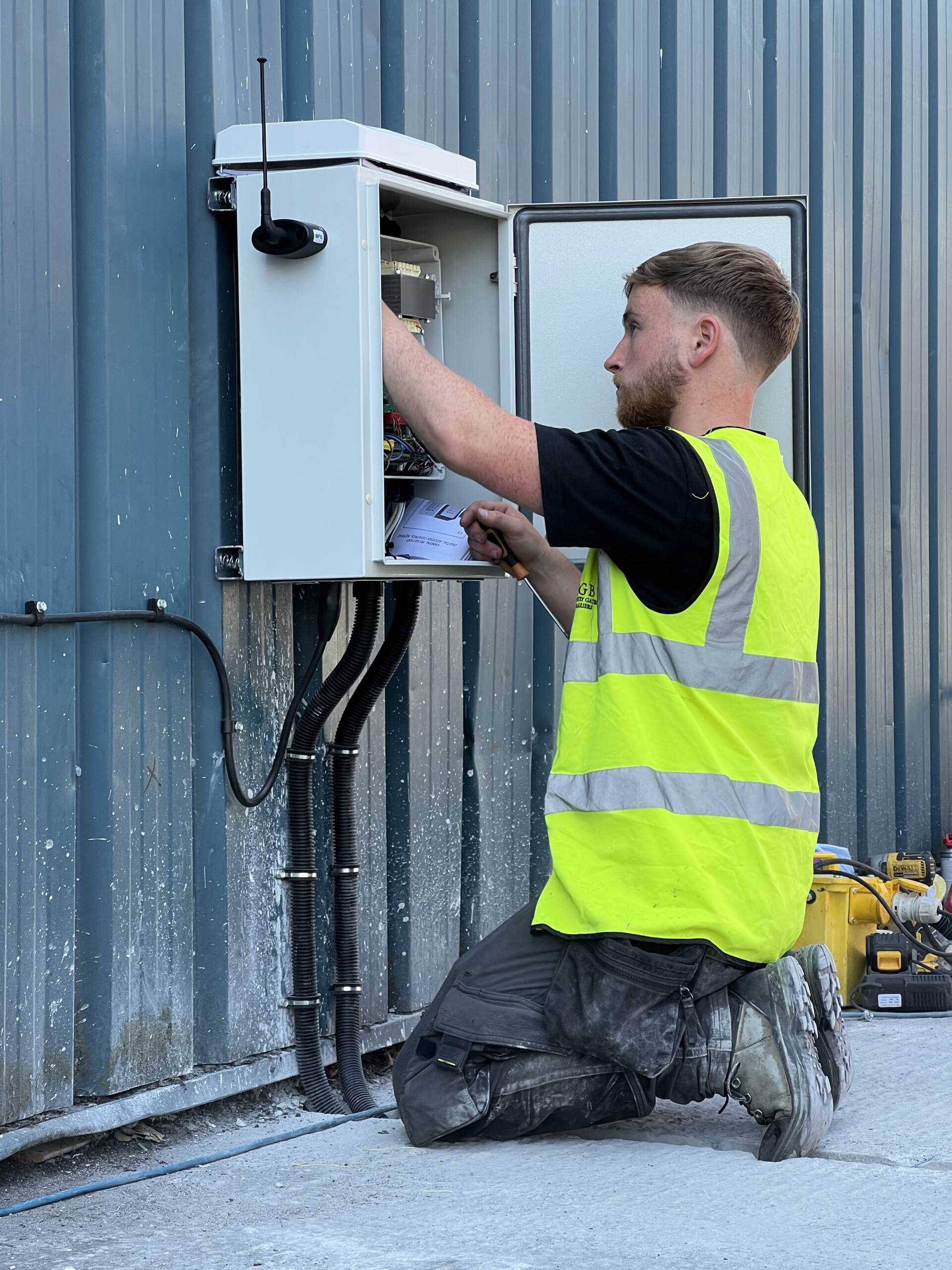gate engineer working on a control panel service and maintenance