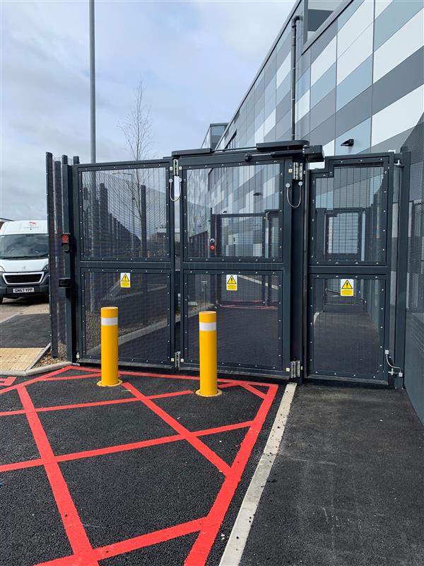 Dark Grey Bi-fold Gate High Security with yellow bollards