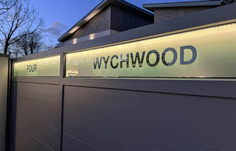 LED Glass Panelling on a Gate in Warm White with the House name